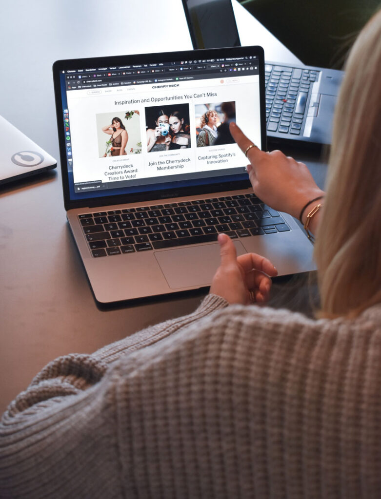 Woman discussing WordPress and WooCommerce managed hosting plans with her team.