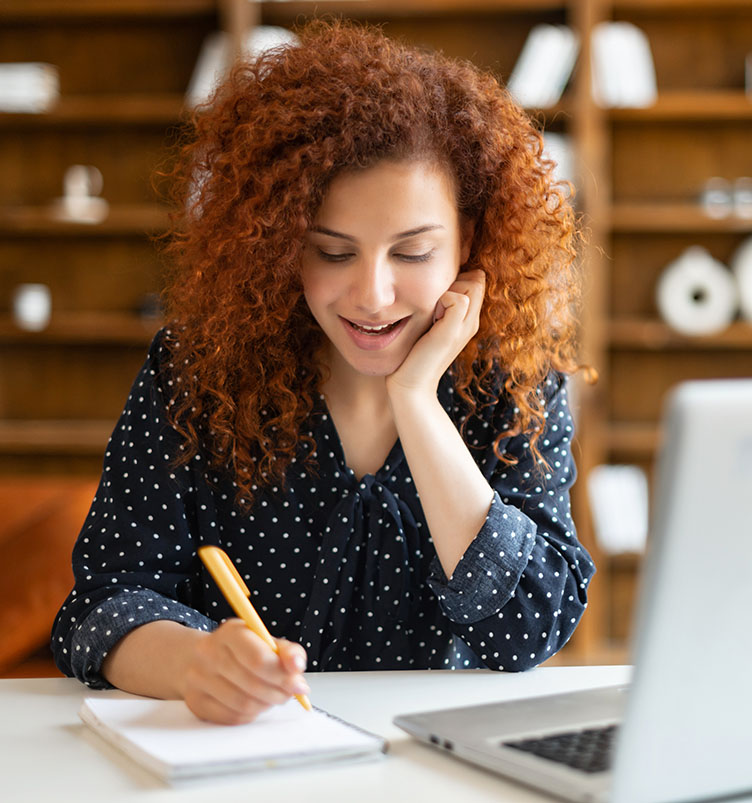 Business woman reviewing ClassicPress hosting options.